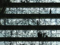 Drifting Moments In silhouette is Drift - a massive, cloudlike stainless steel polyhedral matrix sculpure by Antony Gormley stretching between the 5th and 12th floors of the...